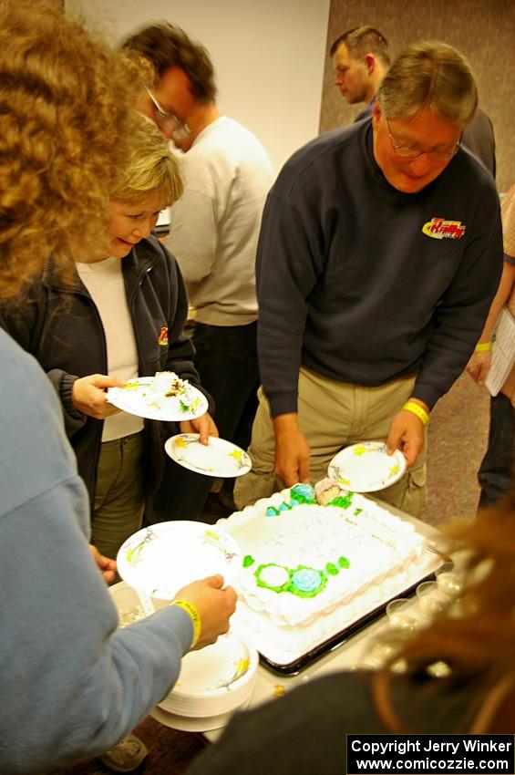 Heidi Meyers and J.B. Niday share wedding cake with Headwaters workers after the event.