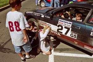 Jim Anderson signs autographs in front of the Honda Prelude VTEC he and Martin Dapot shared