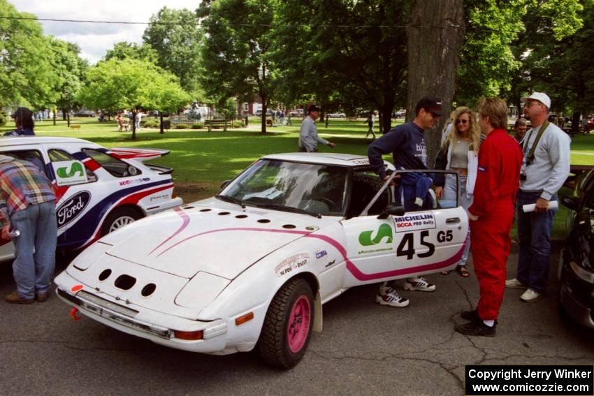 Craig Kazmierczak / Diane Sargent Mazda RX-7 at the green before the rally.