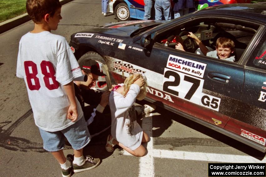 Jim Anderson signs autographs in front of the Honda Prelude VTEC he and Martin Dapot shared