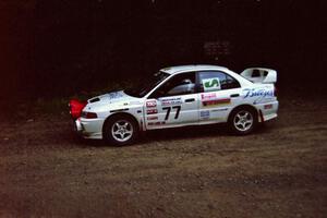The David Summerbell / Mike Fennell Mitubishi Lancer Evo IV asks for fuel while leading at a 90-left on SS7, Wilson Run I.