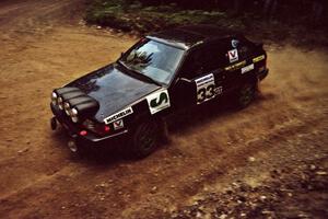 Tom Ottey / Pam McGarvey Mazda 323GTX at a 90-left on SS7, Wilson Run I.