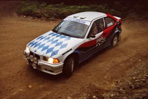 Rick Davis / Ben Greisler BMW 318i at a 90-left on SS7, Wilson Run I.