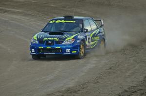 Ken Block / Alex Gelsomino Subaru	Impreza WRX STi at speed on the final corner of SS1 at Bemidji Speedway.