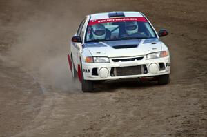 Chris Gilligan / Joe Petersen Mitsubishi Lancer Evo IV at speed through the final corner of SS1 at the Bemidji Speedway.