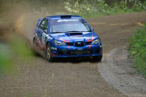 Otis Dimiters / Alan Ockwell at speed on SS2 in their Subaru WRX STi.