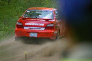 Matthew Johnson / Kim DeMotte Subaru WRX powers out of a left-hander near the end of SS2.