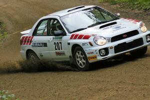 Dave Hintz / Rick Hintz drift through a left-hander on SS2 in their Subaru WRX.