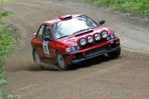 Bob Olson / Ryan Johnson drift through a fast left on SS2 in their Subaru Impreza.