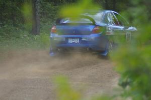 Cary Kendall / Scott Friberg power out of a left-hander on SS2 in their Dodge SRT-4.