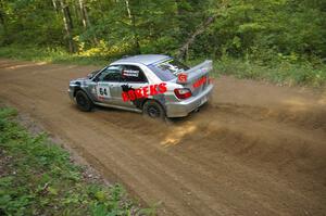 Robert Borowicz / Mariusz Borowicz drift through a fast left-hander on SS2 in their Subaru WRX STi.