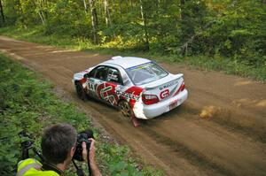 Ken Friberg takes a shot of the Greg Drozd / John Nordlie Subaru WRX at a left-hander on SS2.