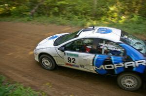 Paul Dunn / Bill Westrick in their Dodge SRT-4 at a fast left-hander on SS2.