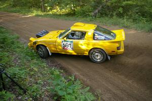 Dave Cizmas / Jake Himes Mazda RX-7 at speed on SS2. They unfortunately were an early DNF.