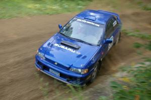 Kyle Sarasin / Stuart Sarasin struck a last minute deal to drive in Bob Olson's Subaru Impreza seen here on SS2.