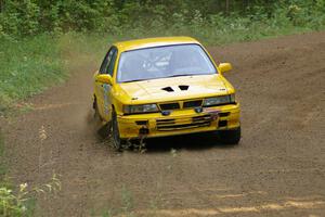 Erik Payeur / Adam Payeur Mitsubishi Galant at speed through a fast left-hander on SS2.