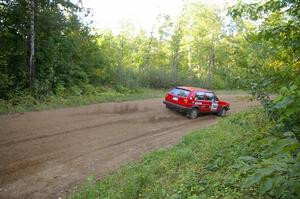 Paul Koll / Matt Wappler VW GTI flies downhill into the flying finish of SS2.