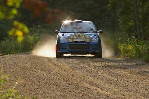 Adam Boullion / Phil Boullion Ford Focus comes across the finish of SS2.