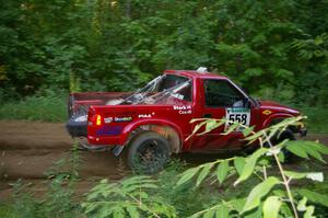 Jim Cox / Chris Stark power out of a hairpin on SS3 in their Chevy S-10.