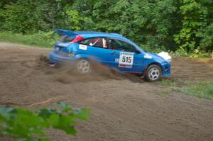 Adam Boullion / Phil Boullion Ford Focus hits the hairpin on SS3 perfectly and gasses it hard.