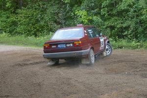 Matt Bushore / Karen Wagner carry too much speed in their VW Jetta at a tight hairpin on SS3.