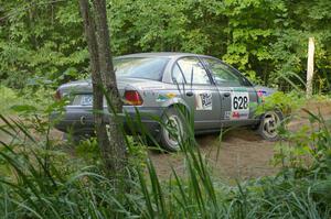 Dan Adamson / Jeremiah Schubitzke Saturn SL2 on SS3 at a hairpin.