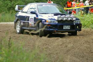 Mitch Williams / Alix Hakala Subaru Impreza at a hairpin on SS3.