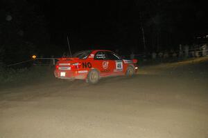 Matthew Johnson / Kim DeMotte Subaru WRX blows the corner and comes face-to-face with a crowd of spectators on SS8, Kabekona.