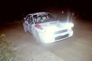 Dave Hintz / Rick Hintz reapply the throttle at a right-hander at the SS8, Kabekona, spectator point in their Subaru WRX.