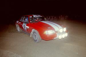 Mark Utecht / Rob Bohn at speed through a 90-right at the crossroads on SS8, Kabekona, in their Ford Mustang.