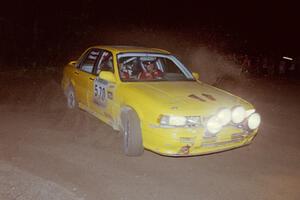 Erik Payeur / Adam Payeur Mitsubishi Galant at the spectator point on SS8, Kabekona.