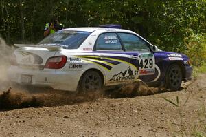 Tanner Foust / Chrissie Beavis Subaru WRX at a hard left-hander on SS9.