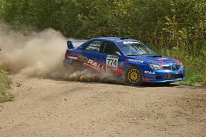 Otis Dimiters / Alan Ockwell prepare for a 90-left on SS9 in their Subaru WRX STi.