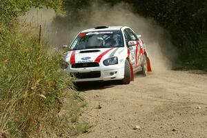 Greg Drozd / John Nordlie set up for a hard left-hander on SS9 in their Subaru WRX.