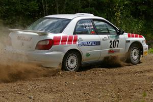 Dave Hintz / Rick Hintz reapply the throttle at a left-hander on SS9 in their Subaru WRX.