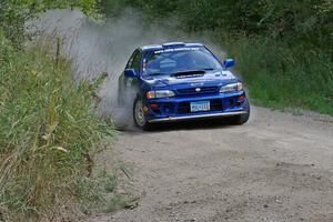 Kyle Sarasin / Stuart Sarasin set up for a 90-left on SS9 in their Subaru Impreza.