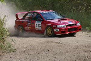 Erik Schmidt / Mike Rose set up for a hard-left on SS9 in their Subaru Impreza.