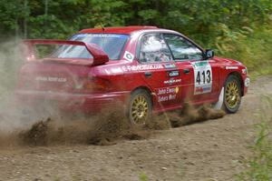Erik Schmidt / Mike Rose drift beautifully after a hard-left on SS9 in their Subaru Impreza.