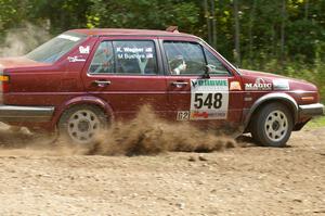 Matt Bushore / Karen Wagner power through a 90-left on SS9 in their VW Jetta.