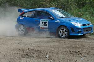 Adam Boullion / Phil Boullion Ford Focus at a hard left-hander on SS9.