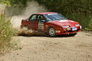 Craig Walli / Jonah Liubakka Saturn SL2 at speed on a 90-degree left-hander on SS12.