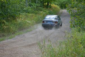 Dan Adamson / Jeremiah Schubitzke hit the gas after a hard left in their Saturn SL2.