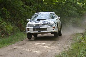 Matt Iorio / Ole Holter get a mild amount of air in their Subaru Impreza over the jump on SS13.