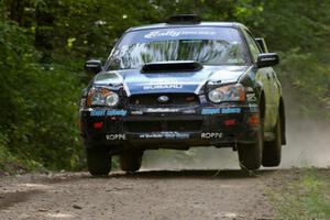 Jonathan Bottoms / Carolyn Bosley Subaru WTX STi gets slight air at the jump on SS13.