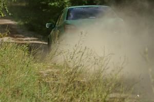 Eric Langbein / Jeremy Wimpey Subaru WRX speed away down the straight after the jump on SS13.