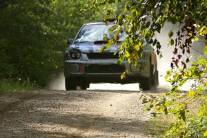 Robert Borowicz / Mariusz Borowicz caught no air at the jump on SS13 in their Subaru WRX STi.