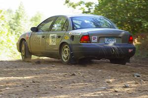 Dan Adamson / Jeremiah Schubitzke at uphill right on SS13 in their Saturn SL2.