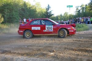 Dave Anton / Dominik Jozwiak go wide at the spectator corner on SS14 in their Subaru WRX STi.