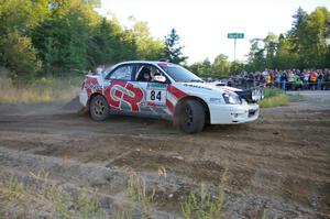 Greg Drozd / John Nordlie drive past the horde of spectators at SS14 in their Subaru WRX.