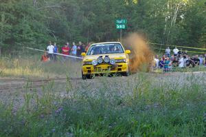 Erik Payeur / Adam Payeur throw a wave of gravel skyward at the spectator point on SS14 in their Mitsubishi Galant.